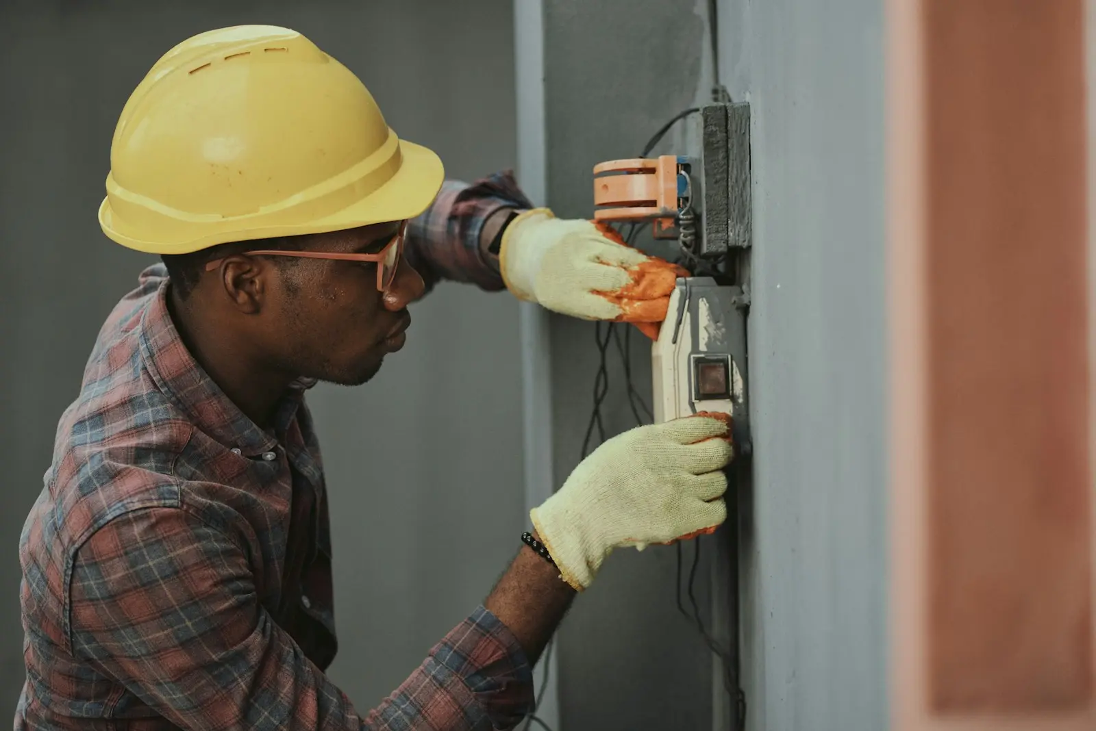 Electrician wiring an industrial control panel