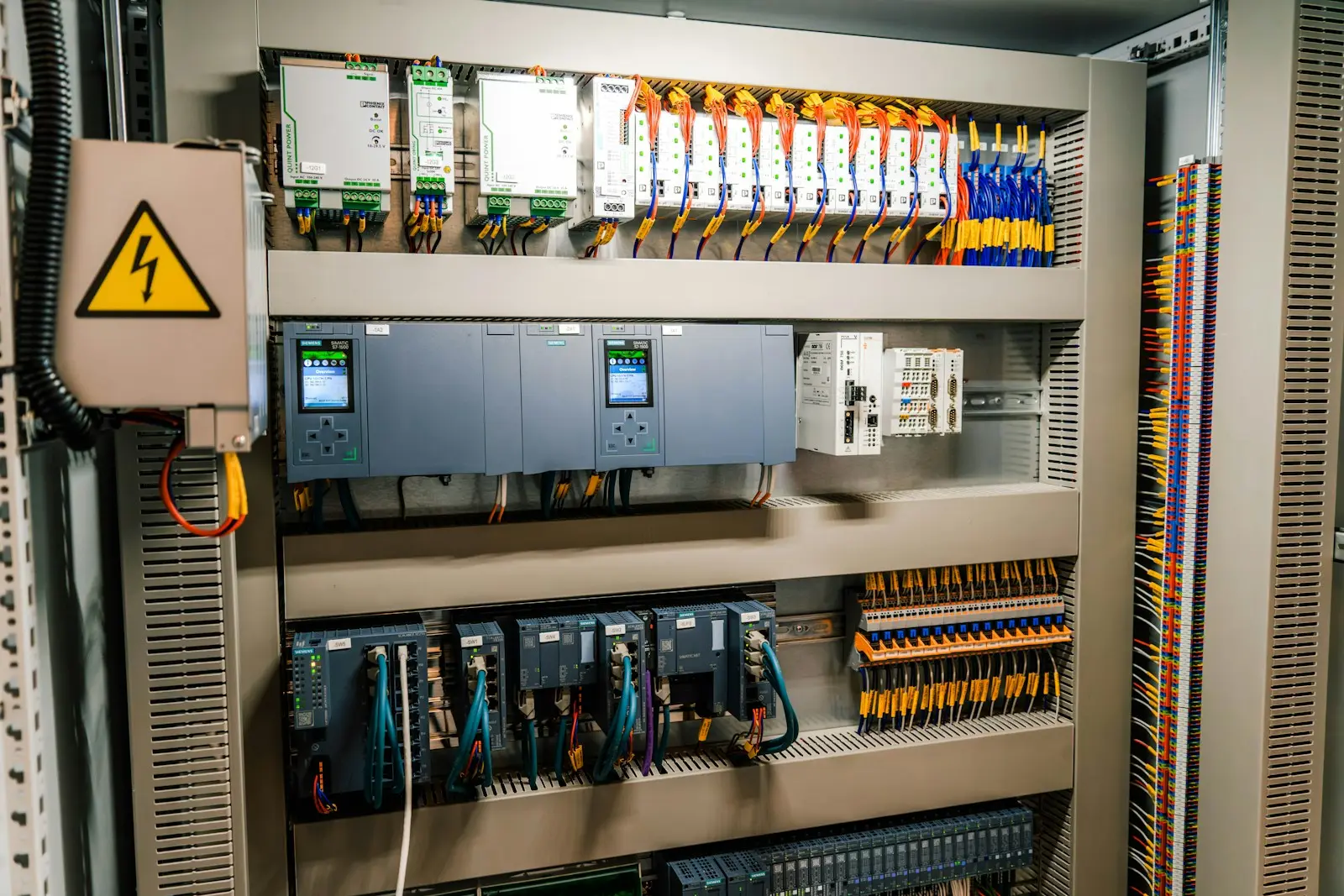 IIoT gateway and edge controller mounted on DIN rail in an industrial control panel