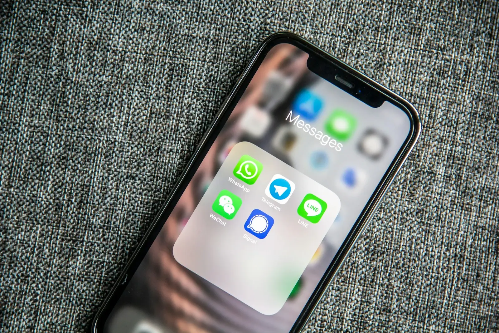 WhatsApp Business on a smartphone used for automated enquiries and alarms